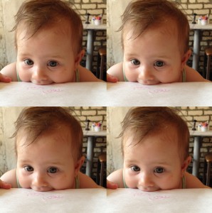 Baby biting a table